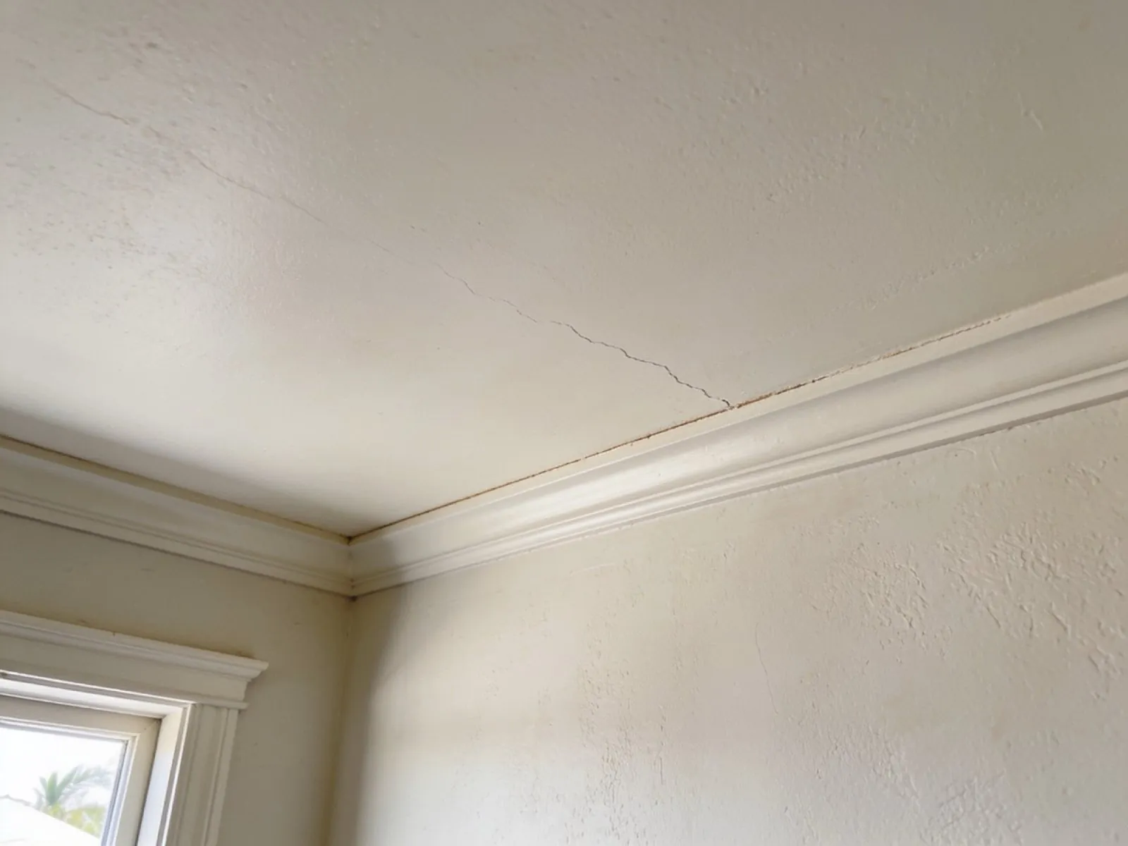 Cracked ceiling before repair