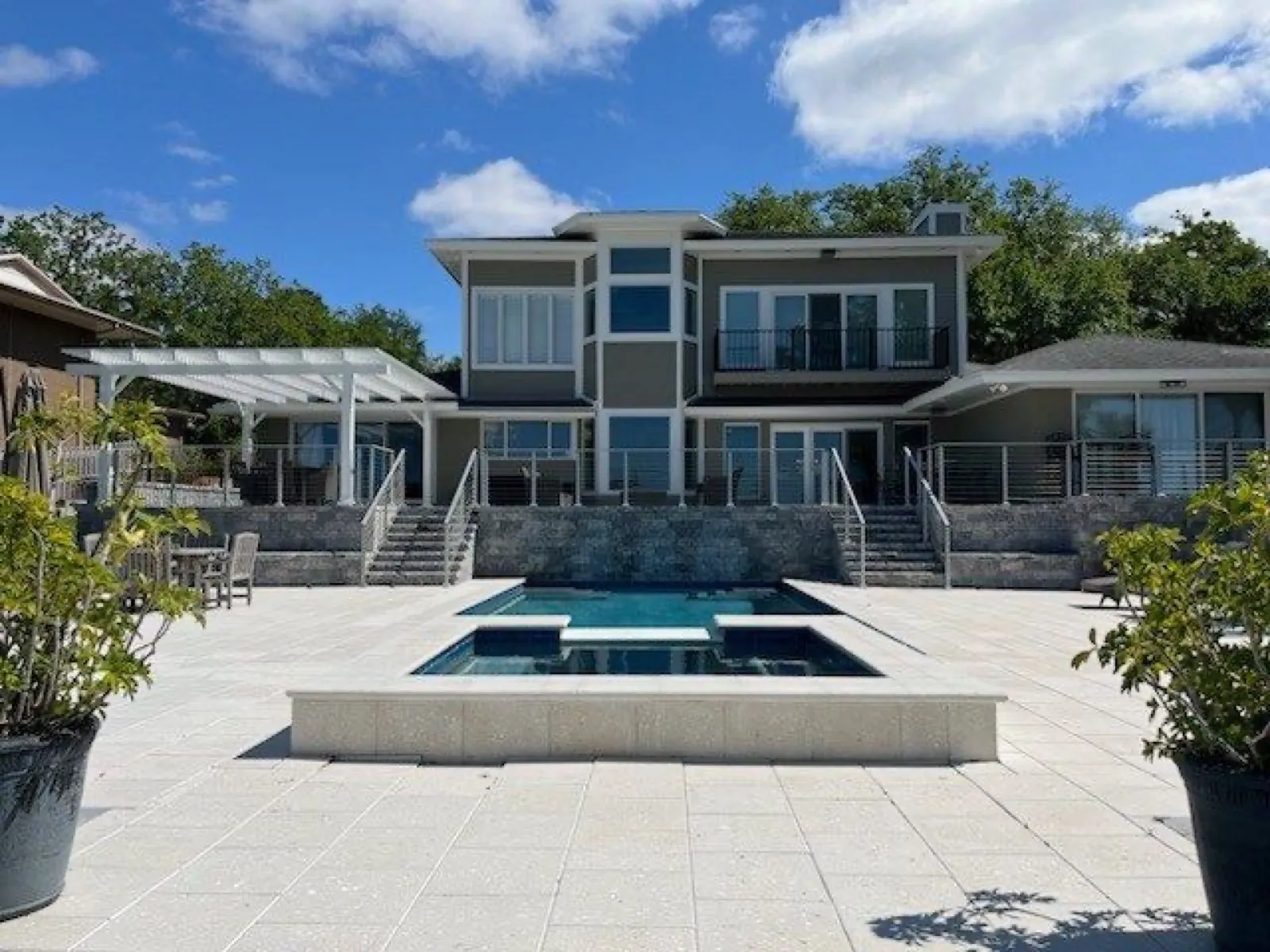 Two-story home with a lanai, pool and paver deck